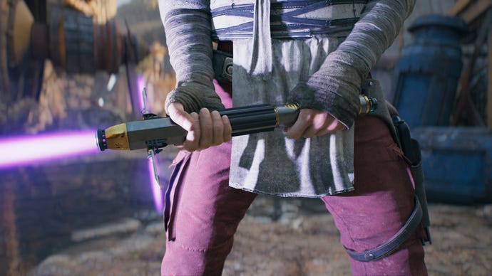 A close-up screenshot of a purple-bladed lightsaber in Cal’s hands in Jedi: Survivor.