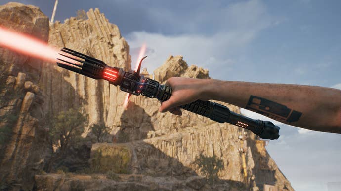 A close-up screenshot of a red-bladed lightsaber in Cal’s hand in Jedi: Survivor.