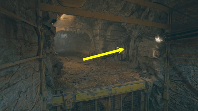 A cave passage on Koboh in Jedi: Survivor, with an arrow pointing to the right where Vashtan Wolfe’s Lair can be found.