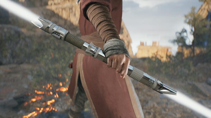 A close-up screenshot of a white-bladed lightsaber in Cal’s hand in Jedi: Survivor.