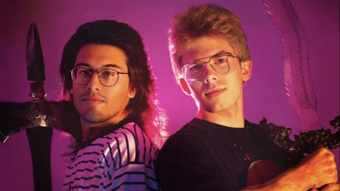 Jon Romero and Jon Carmack stand back to back in a photo