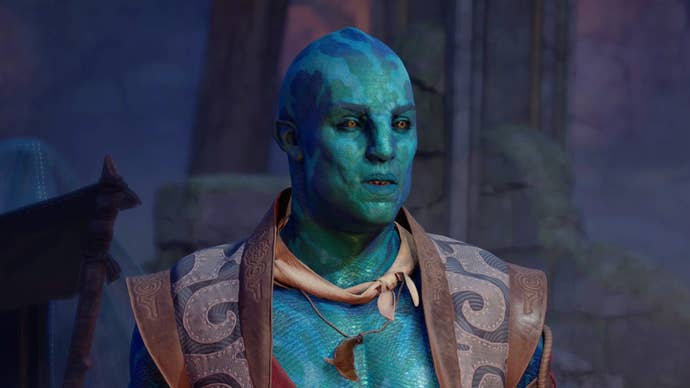 A close-up of Kai, one of Avowed’s companions. Kai is a fish-like aumaua with blue, scaled skin. He wears a leather vest and a pendant shaped like a whale.