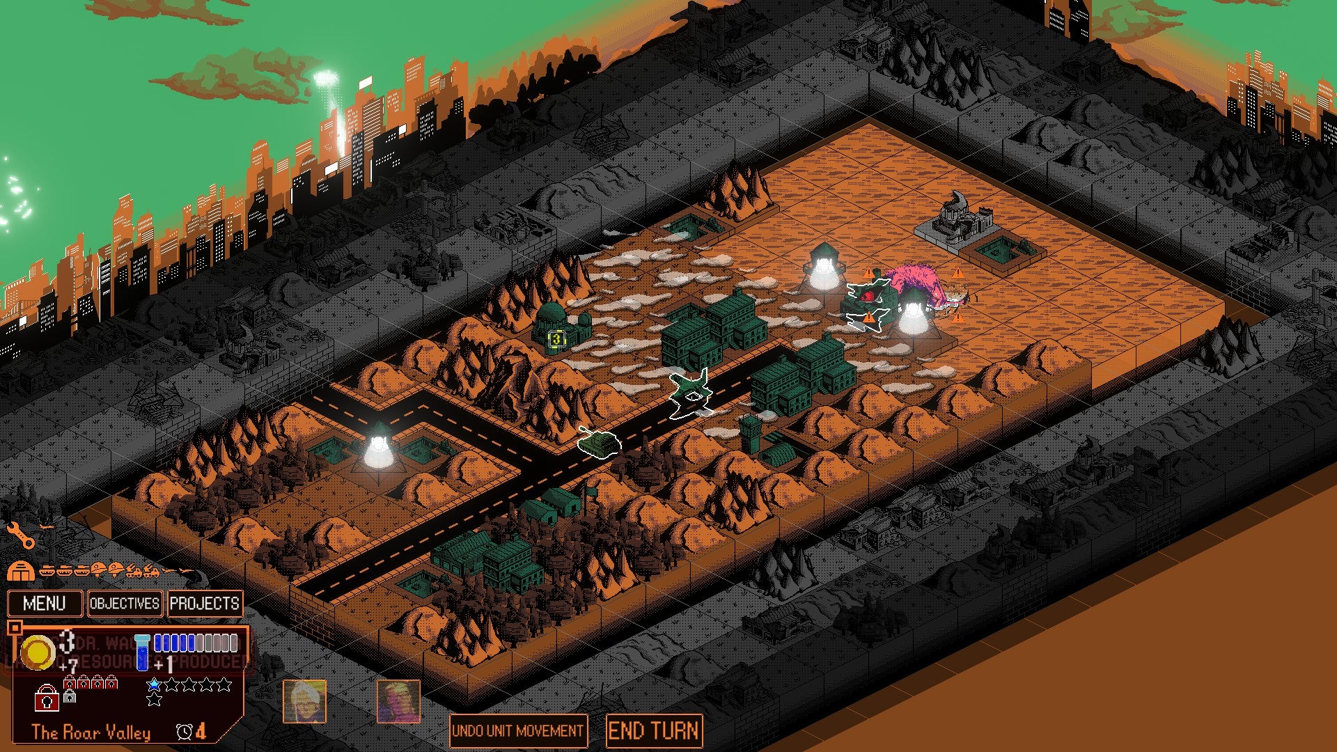 Kaiju Wars review - a rectangular, brown battlefield with a green outline and darker green buildings, as tanks and planes manouvre.