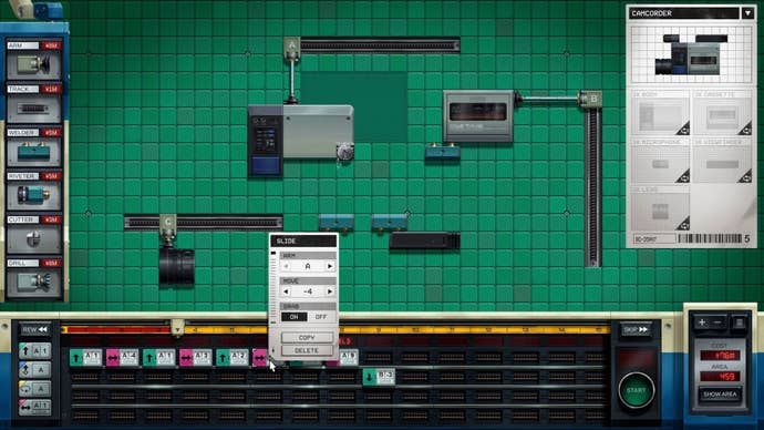 A camcorder is being constructed from its assorted parts connected the workspace.