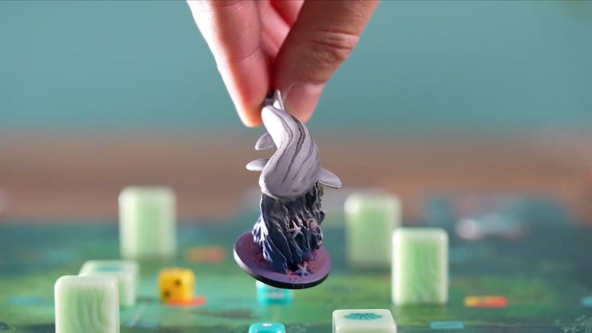 Screenshot of shark miniature from board game Kelp's Kickstarter video