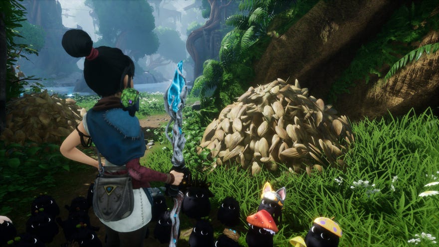 Kena contemplates a Hay Pile in Kena: Bridge Of Spirits.