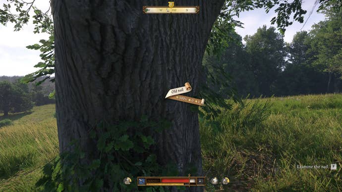 The player in Kingdom Come: Deliverance 2 finds a border nail hammered into a tree trunk in the middle of a pasture.
