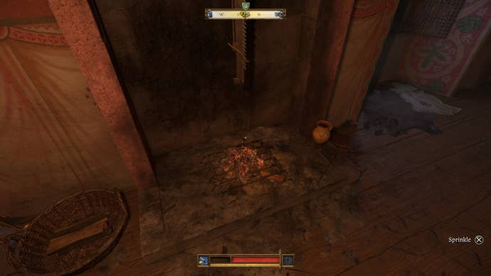 Henry sprinkling holy water on a fireplace on the Crone side of Trosky Castle during the Demons of Trosky quest in Kingdom Come Deliverance 2.