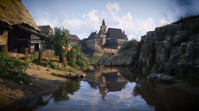 A river in Kingdom Come: Deliverance 2 flows through a settlement towards a fort in the background.