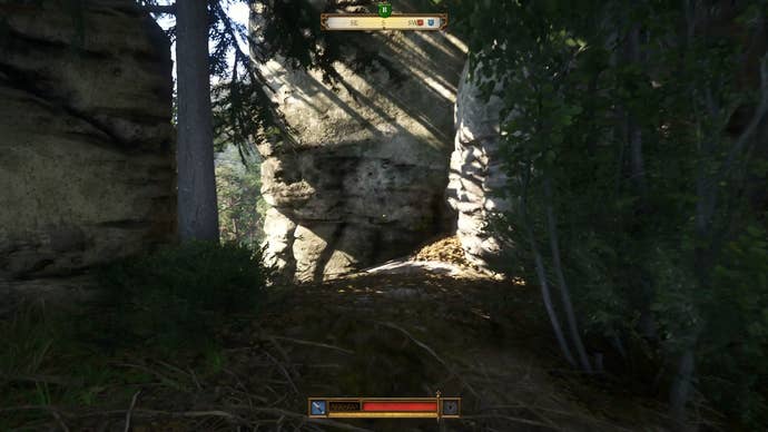 The rock face marking the entrance to the Hermit’s shack in Kingdom Come Deliverance 2.