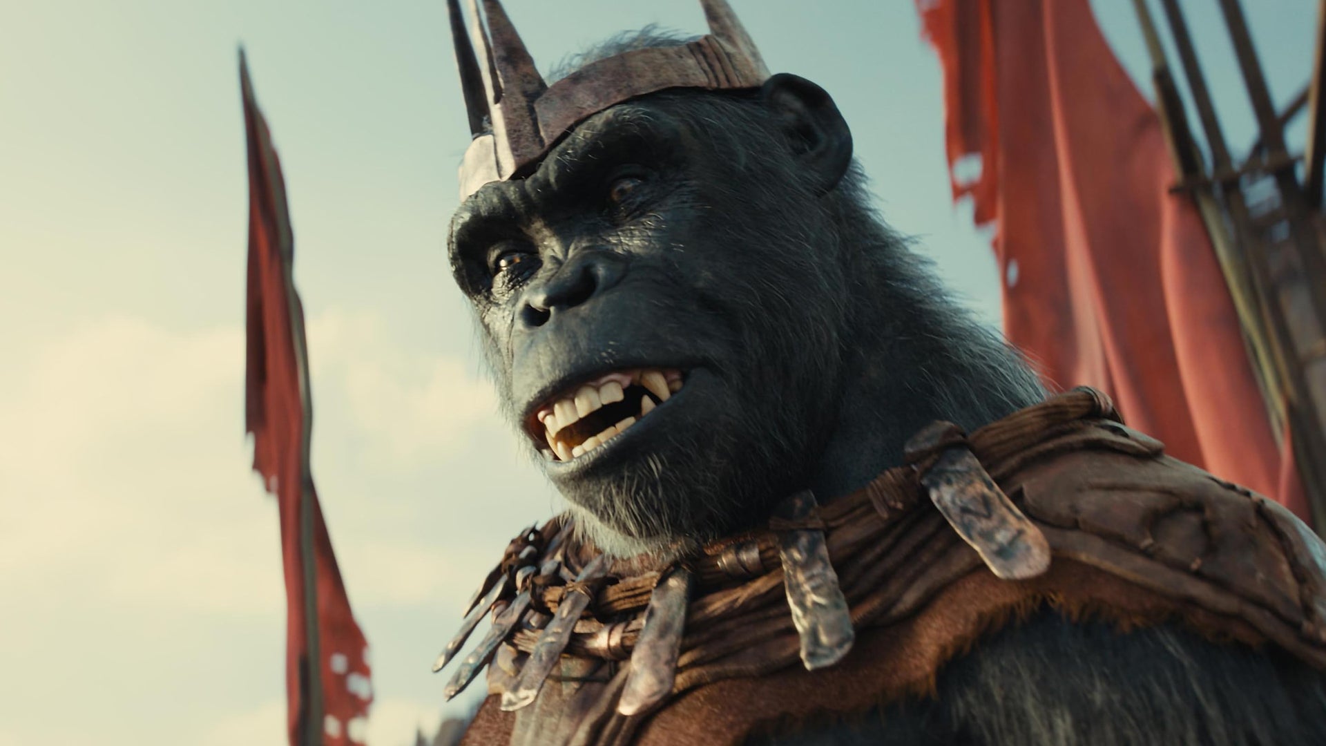 An ape wearing a three pronged crown looking down at something.