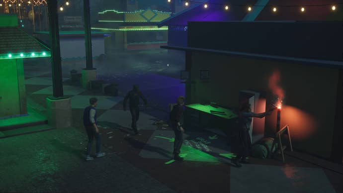 A group of scared humans in Killer Klowns From Outer Space: The Game