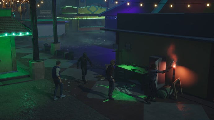 A group of scared humans in Killer Klowns From Outer Space: The Game