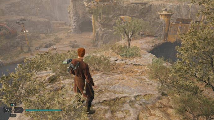 Cal looks at a glowing plant on Koboh in Jedi: Survivor.