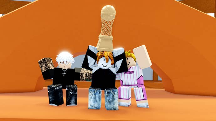 Three basketball players holding a trophy aloft after winning a match in Kuroku’s Basket: Showdown.