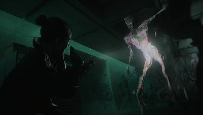 A huge paint monster looming over a woman with a gun in Alan Wake 2’s Lake House DLC