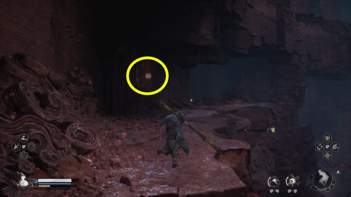 Exploring the Pagoda Realm in Black Myth: Wukong. A lantern hanging above an alcove is circled to indicate the right direction to go.