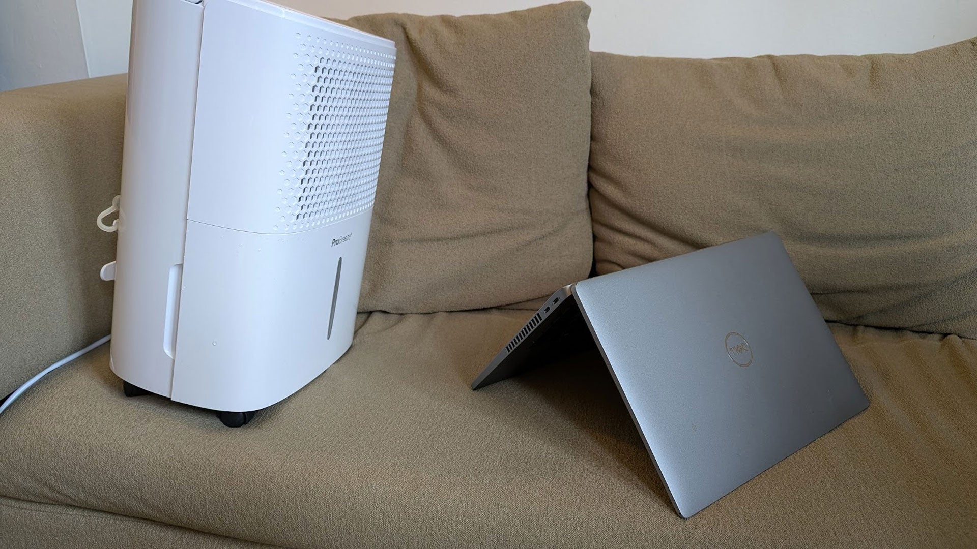 A dehumidifier tries in vain to dry out a laptop - 1