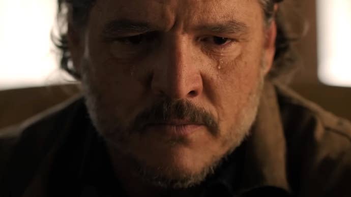 Pedro Pascal as Joel in a scene from The Last of Us' second live-action season, here seen in a close-up with a single tear rolling down his cheek.