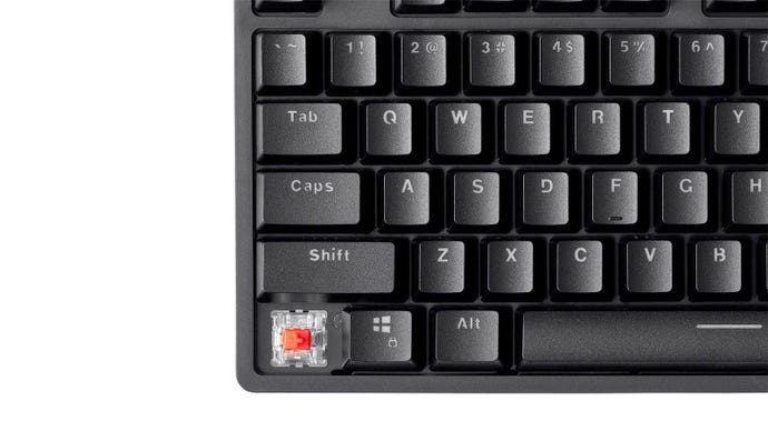 a close-up photo of the dark matter monoprice keyboard, showing its keycaps and switches