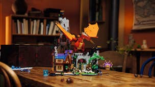 A Lego Dungeons & Dragons set showing a red dragon atop a bridge, placed on a table in a living room.
