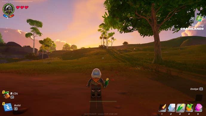 Lego Fortnite brightcore location: A lego man stands in a patch of dirt and looks toward the horizon, where the desert awaits.