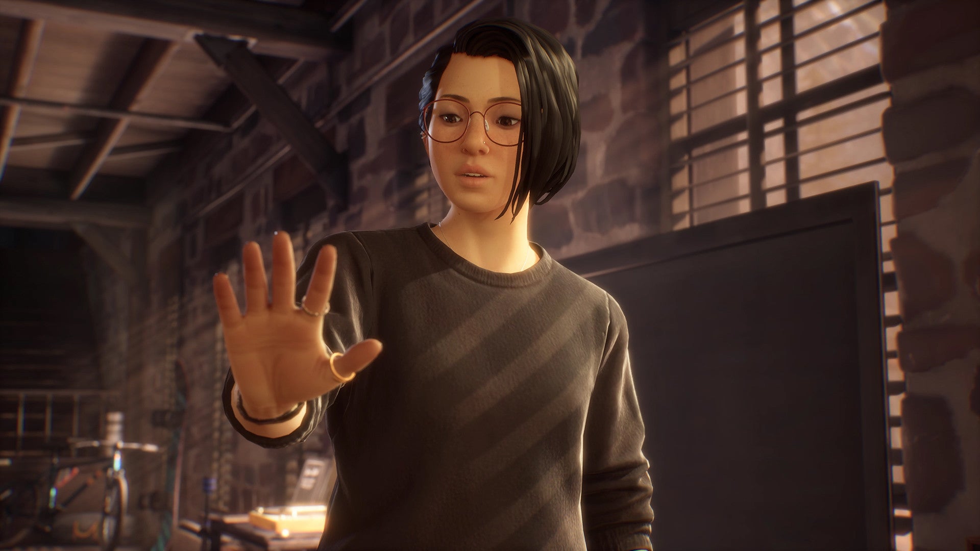 A screenshot of Life Is Strange: True Colors showing protagonist Alex Chen, a young woman with the supernatural ability to &ldquo;experience, absorb and manipulate the strong emotions of others."