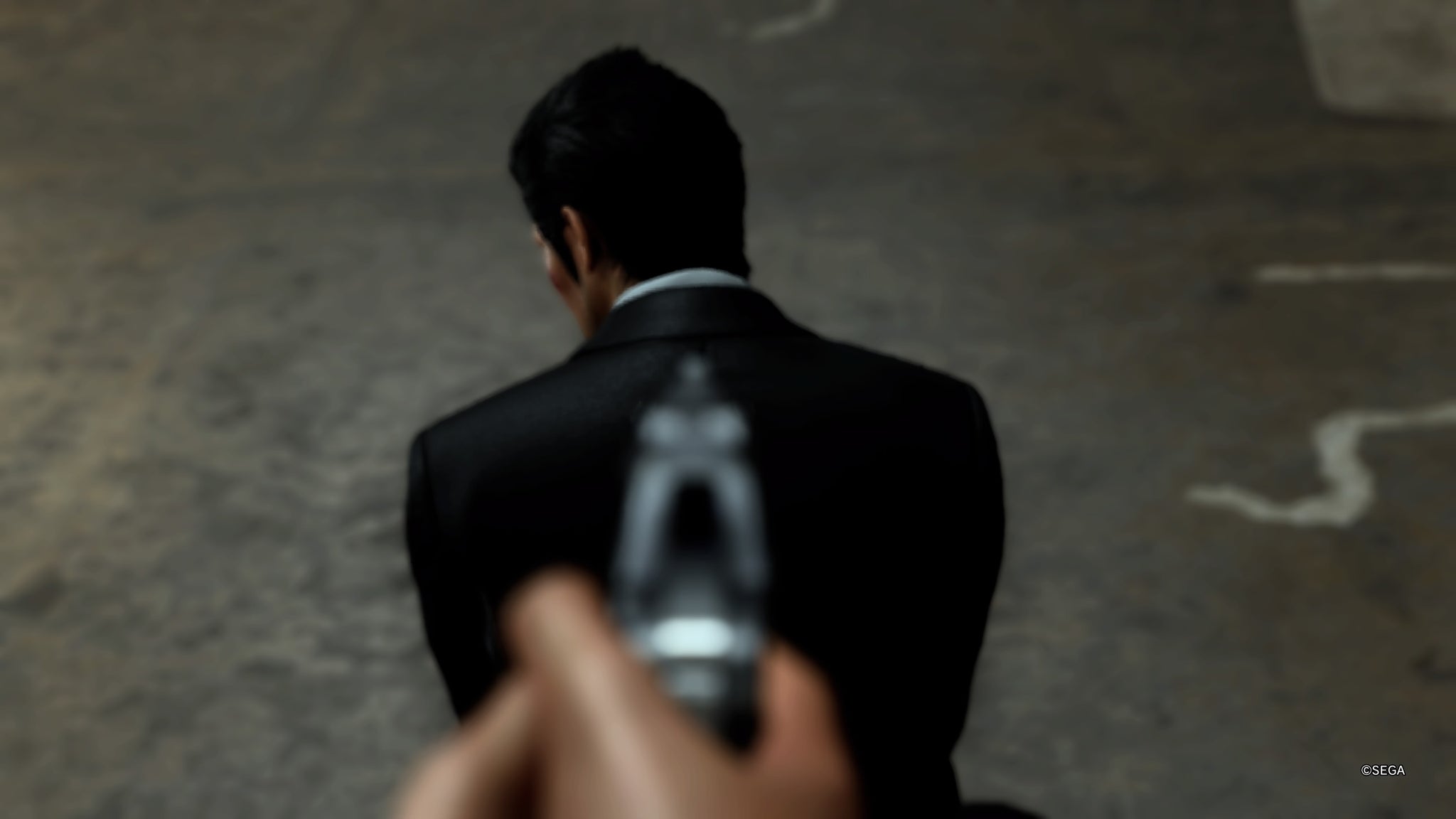 A gun being pointed at Kazuma Kiryu in Like A Dragon Gaiden. - 3