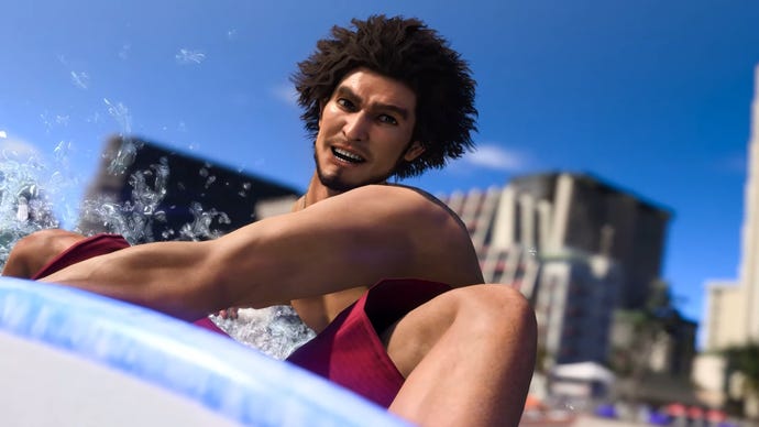 Like A Dragon Infinite Wealth jobs: Ichiban Kasuga, wearing a red swimsuit, is surfing, riding a wave on a light blue surfboard with the skyline of Honolulu behind him