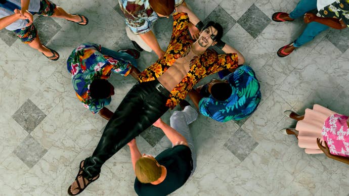 Goro Majima being lifted by a gang of strangers in Like a Dragon: Pirate Yakuza in Hawaii.
