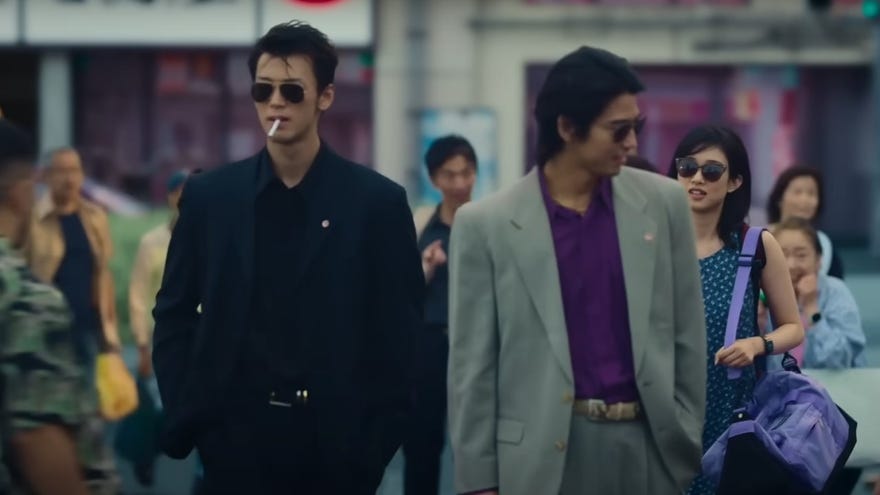 Two members of the Yakuza strut through a busy street in Prime Video’s Like A Dragon: Yakuza official trailer.