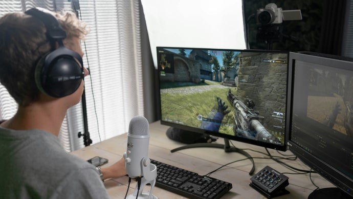 A person live streaming a video game setup