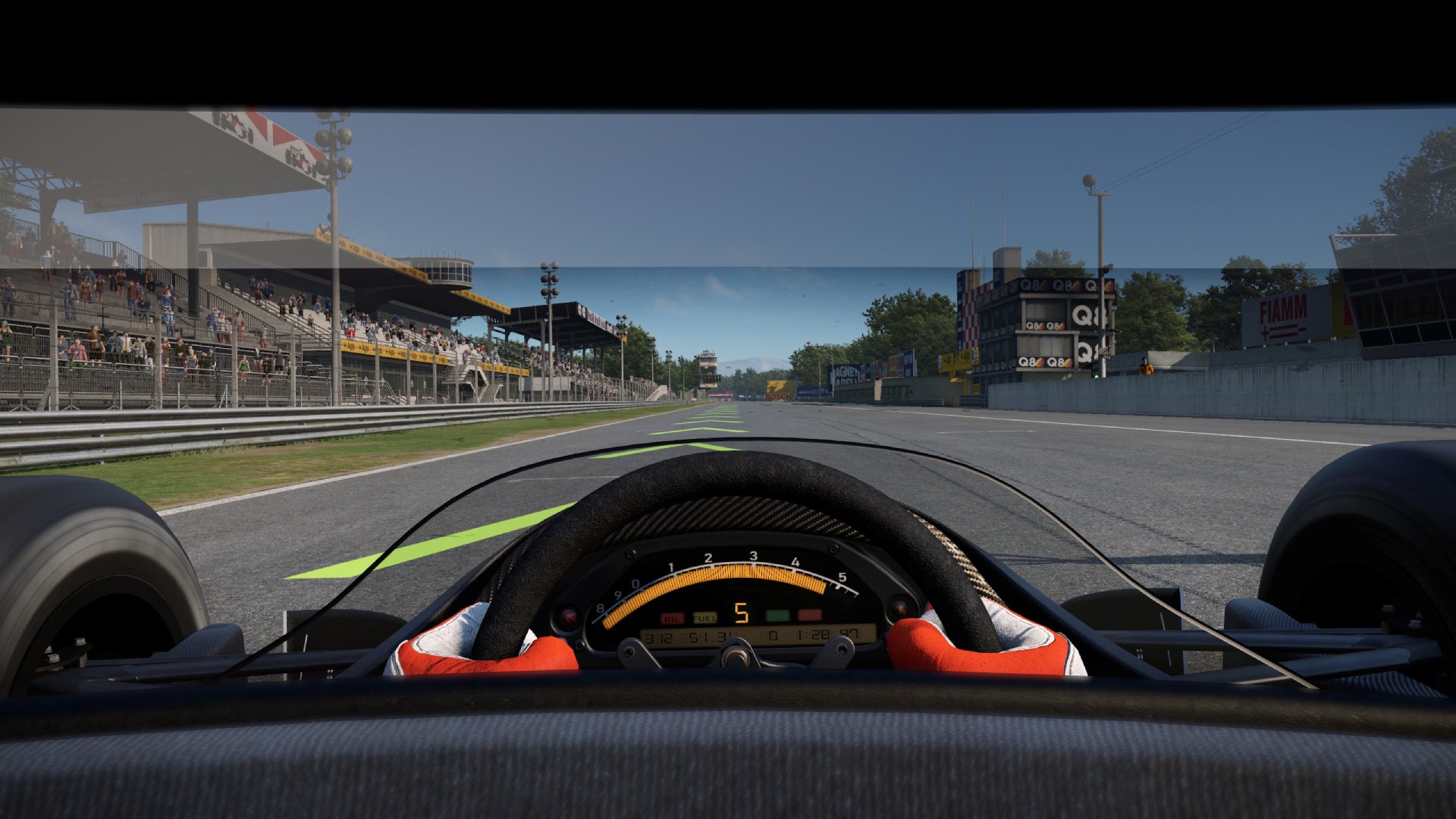 A retro F1 car going down the straight at Monza on Automobilista 2.