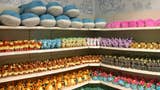 A photo showing shelves lined with Pokémon merchandise at a Pokémon Center.