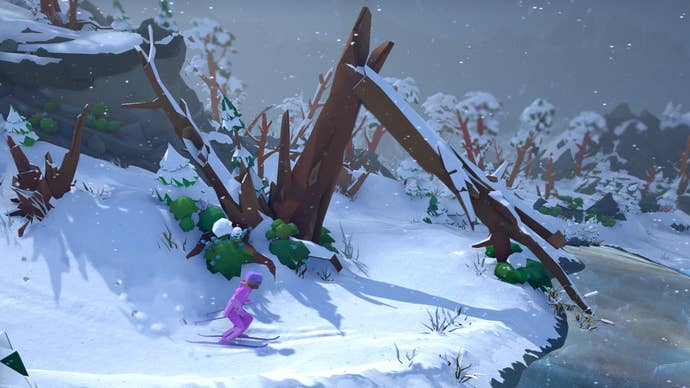 A Lonely Mountains: Snow Riders screenshot showing a pink-clad player skiing beside an icy lake beneath a grey sky, about to pass under a huge arch formed from two toppled tree trunks.
