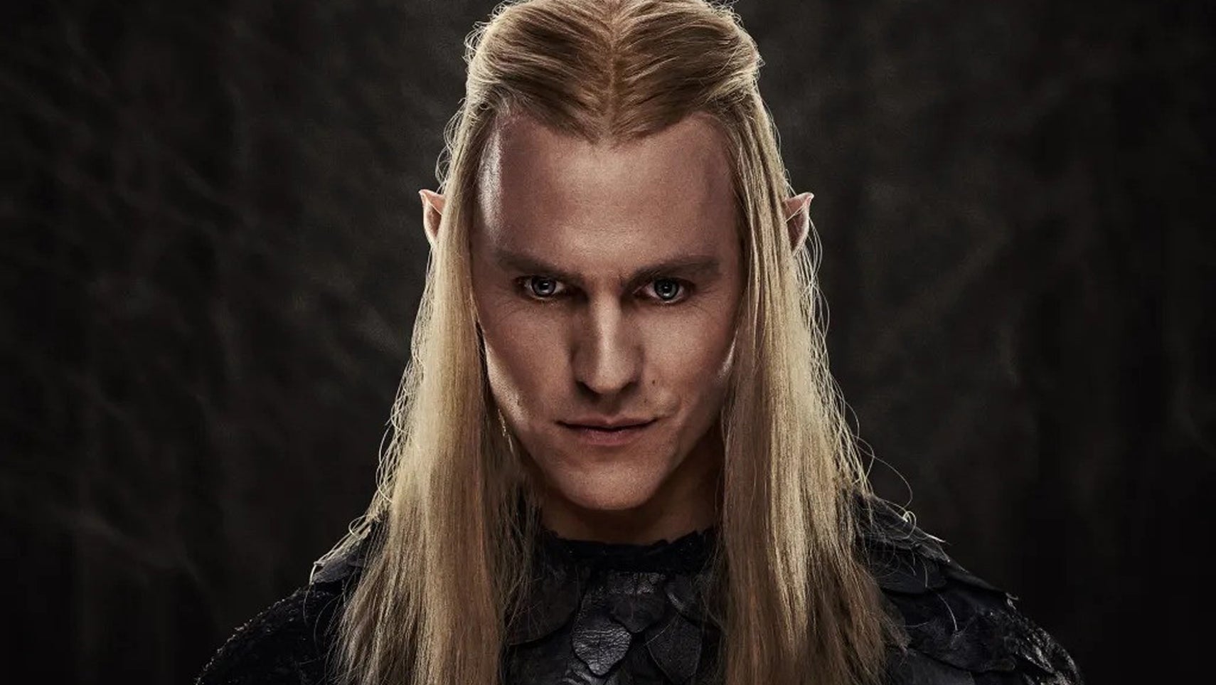 Sauron from Lord of the Rings: The Rings of Power stood with an evil smile on his face in a black void. - 1