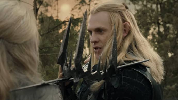 Sauron fighting Galadriel, their swords pressed against each other, a spiky crown caught between them.