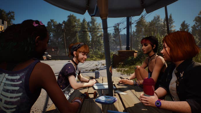 The four friends around a picnic table in Lost Records: Bloom & Rage.