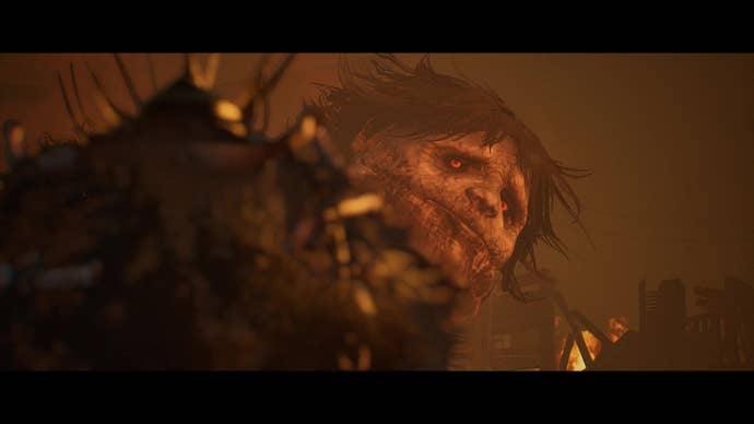 A screenshot from Lords Of The Fallen that shows an enormous, almost childish face turn to the player.
