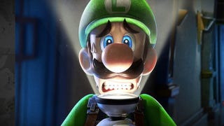 A close-up of Luigi looking terrified and lit from below by a torch.
