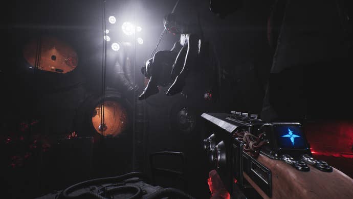 A large doll like creature hangs from the ceiling in Luna Abyss