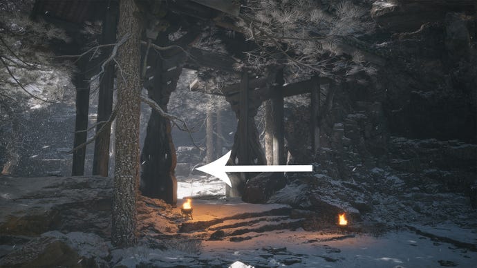 A snowy gate with burning flames in Black Myth Wukong.