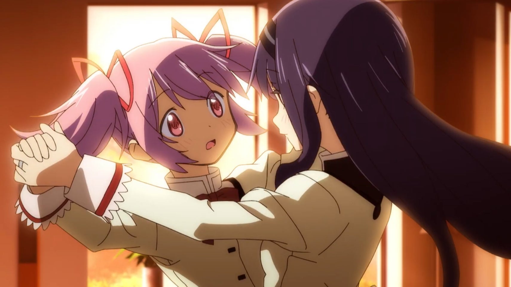 A still from Madoka Magic Walpurgisnacht Rising of Madoka looking surprised while dancing with Homura. - 1