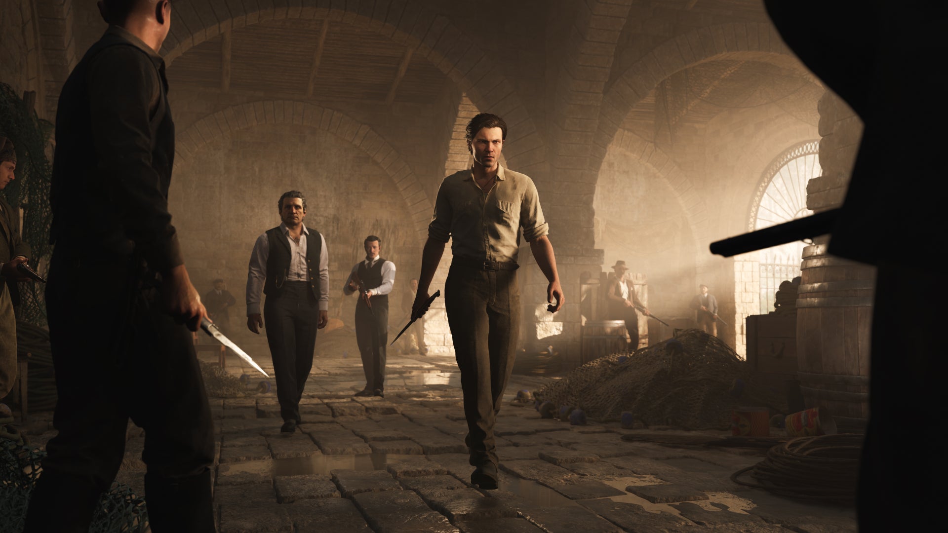 Enzo, Don Torrisi and others walking into a building in Mafia: The OId Country. - 1