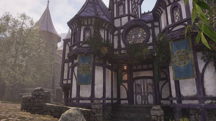 The exterior of the Mages Guild in Cheydinhal. It is a Germanic-style building with purple and white decorations.