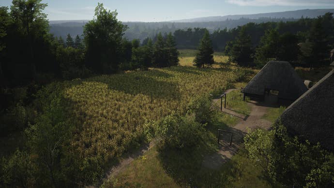 A Wheat Farm next to a Farmhouse in Manor Lords.