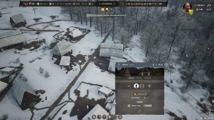 A top down view of a snow-covered Smithy in Manor Lords.