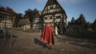 A man in a red cape and hat stands in front of a large house in Manor Lords.