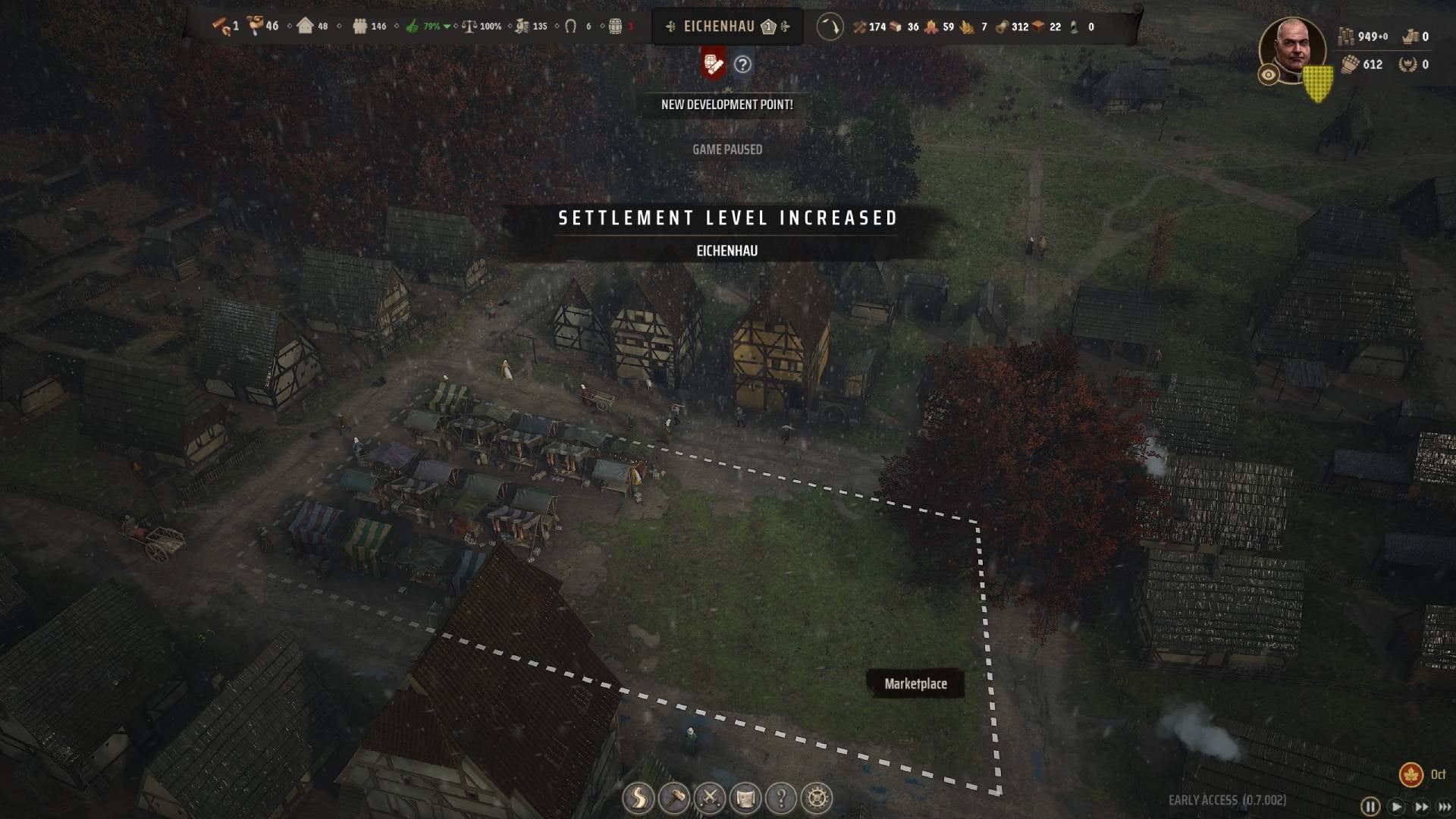 An overhead view of a settlement with the menu prompt stating that &ldquo;Settlement Level Increased&rdquo; in Manor Lords