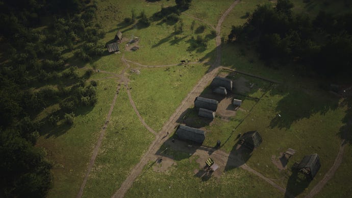 An aerial view of a Manor Lords village with just enough Burgage Plots to remove the initial tents.